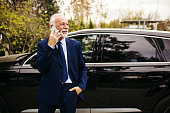 Senior adult businessman talking on the phone