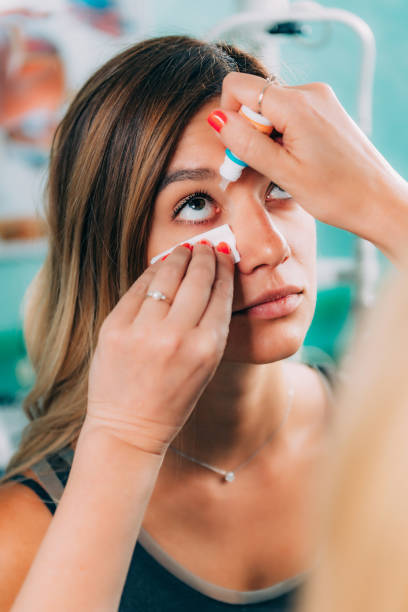 istock Eye Drops. Ophthalmologist Using Eyedropper With Beautiful Female Patient 1076080414