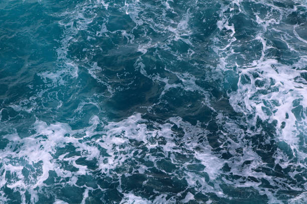 istock blue and white foamy ocean waves 1076080914