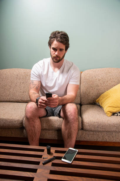 istock A young male diabetic patient at home testing his blood sugar. 1076081316