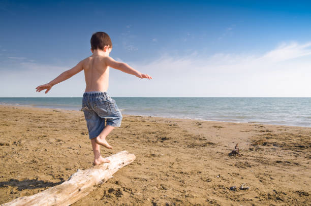 Child play on the beach stock photo