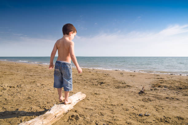 Child play on the beach stock photo