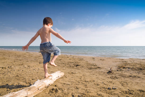 Child play on the beach stock photo