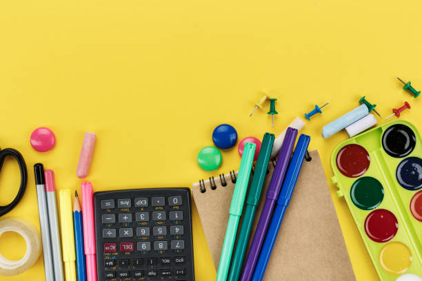 istock school supplies to study on a yellow background. 1076091710