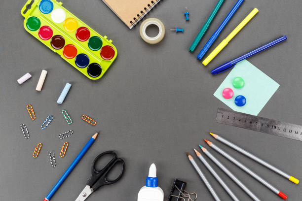 istock school supplies for study on a gray background. 1076091782