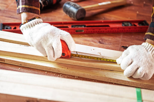 istock Building DIY while used tape measure. Professional carpenter working with wood and building tools in house for renovate. 1076091876