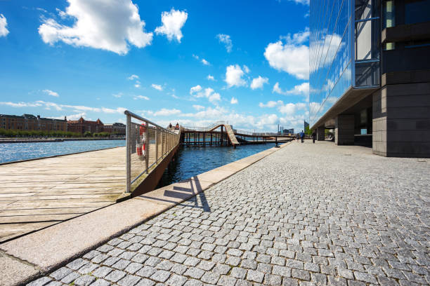 Kalvebod bridge, wood  outdoor park near river and modern office in Copenhagen, Denmark stock photo