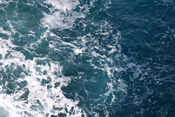 istock blue and white foamy ocean waves 1076093162