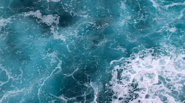 istock blue and white foamy ocean waves 1076095870
