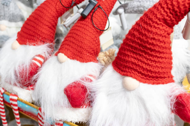 istock Christmas soft toy dwarfs sitting on the store shelf 1076098304