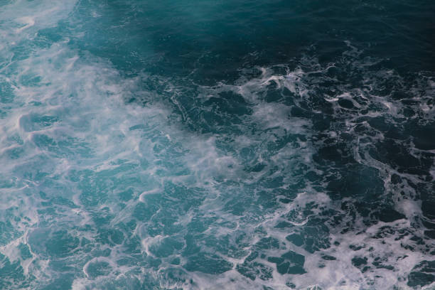 istock blue and white foamy ocean waves 1076099458