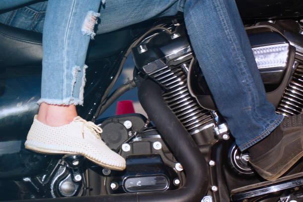 Female motocross rider getting ready to ride on dirt track