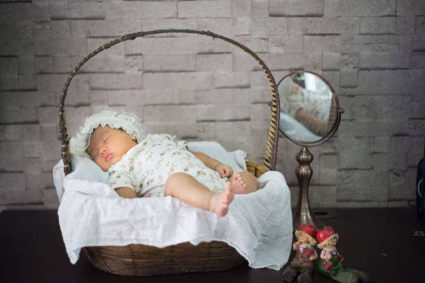 istock Infant sleep on the basket bed 1076100658