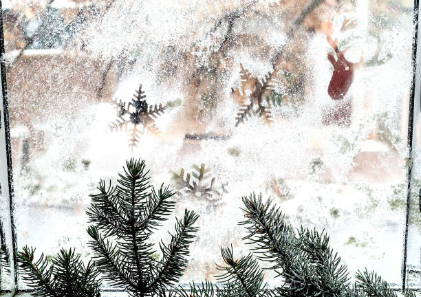 istock Winter pattern of snowflakes on the window. Closeup. Copy space. 1076101902
