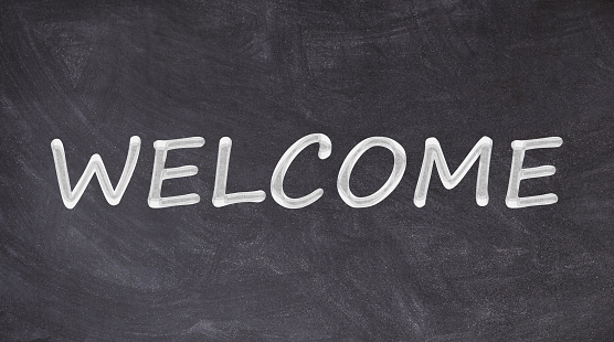 Welcome written on blackboard