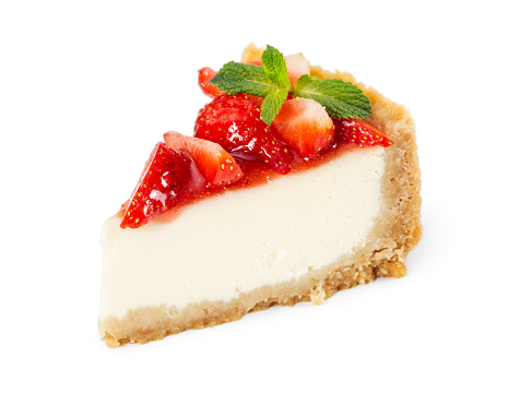 Piece of cheesecake with fresh strawberries and mint isolated on white background