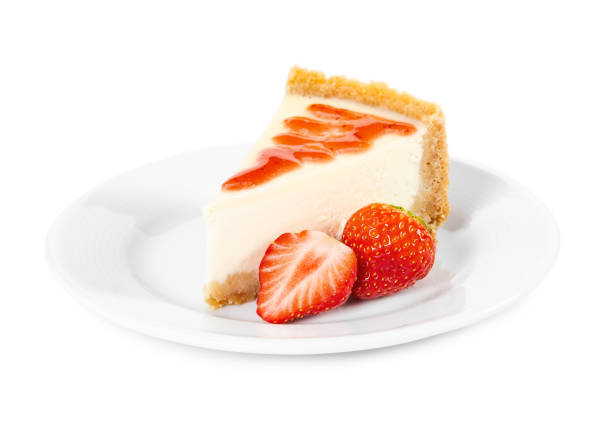 istock Piece of cheesecake with fresh strawberries on white plate 1076104200
