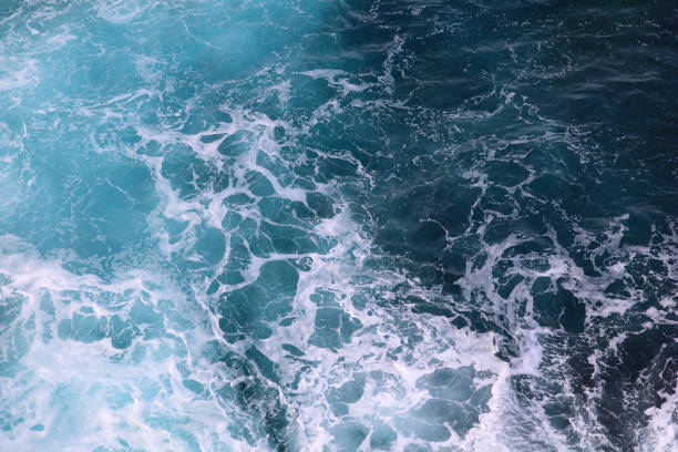 istock blue and white foamy ocean waves 1076104404