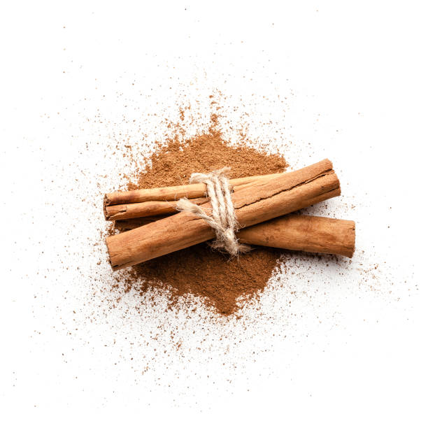 istock Cinnamon powder heap isolated on white background 1076107766