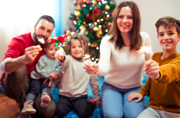 istock Happy family with burning sparklers 1076116222