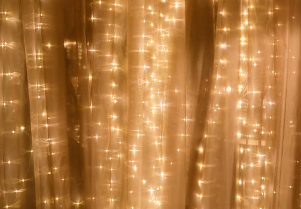 Soft curtain with string lights Soft curtain with string lights light strings stock pictures, royalty-free photos & images