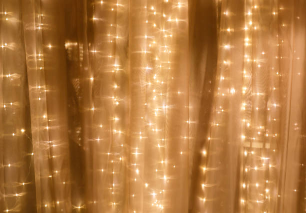 soft curtain with string lights - twinkle lights imagens e fotografias de stock