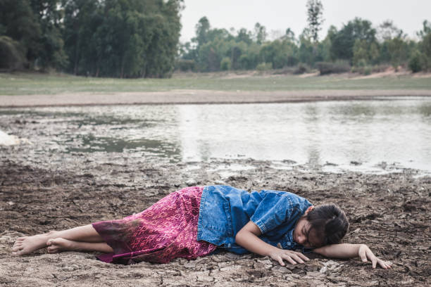 istock Girl Lying On Drought Land 1076135342