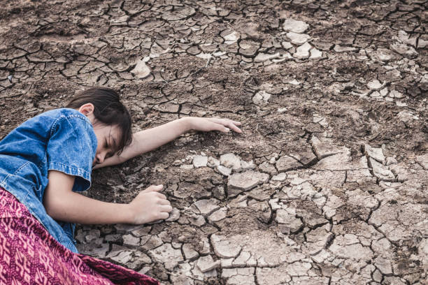 istock Girl Lying On Drought Land 1076135470