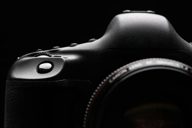 istock Professional modern DSLR camera low key stock photo/image 1076148088