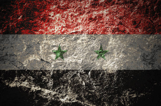 istock Syria flag on grunge stone background 1076153440