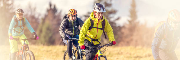 istock Front view of four friends mountain biking 1076160232