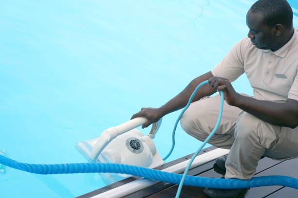 istock Hotel staff worker cleaning the pool 1076163806
