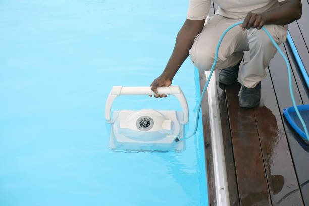 istock Hotel staff worker cleaning the pool 1076164984