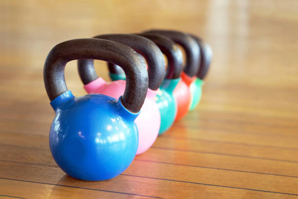 istock Colorful kettlebells in gym 1076165604
