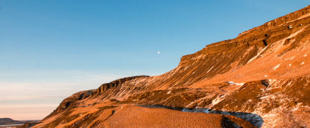 Moon & Mountain in Iceland Winter Mountains and blue sky in Iceland erde stock pictures, royalty-free photos & images