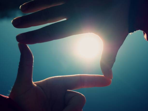 istock Female hands making finger shape gesture, hand  hold sun 1076176812