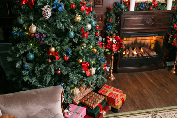 istock Presents and Gift boxes under Christmas Tree. Colorful boxes with ribbon bow. New year decorated house interior. Winter Holiday concept. 1076177654