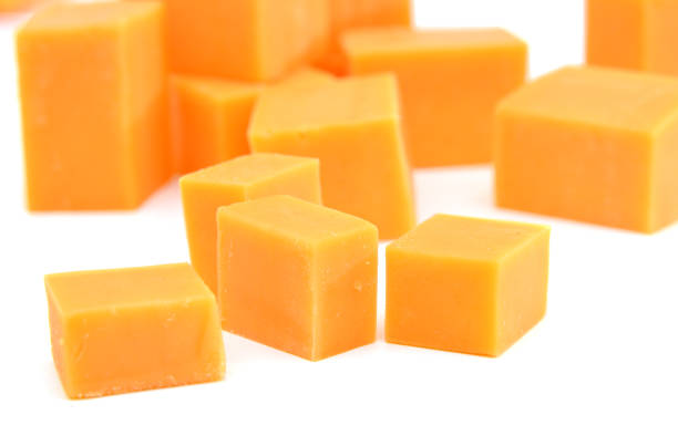 istock piece of cheese isolated on a white background 1076183380
