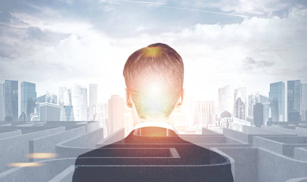 istock Businessman looking at labyrinth in a city 1076185286