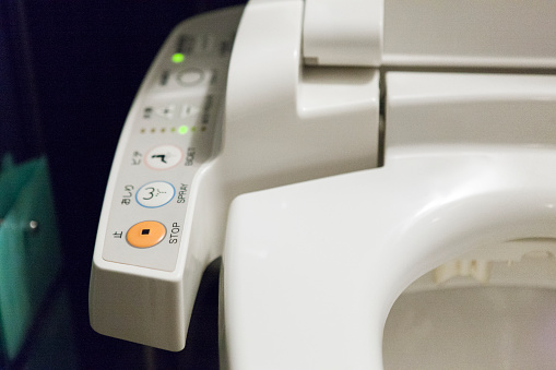 Modern toilet with technological customization in Tokyo, Japan.