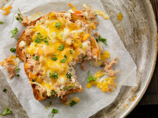 Tuna Melt on Toast Tuna Melt on Toast with Onions, Peppers and Parsley melting tuna cheese toast stock pictures, royalty-free photos & images