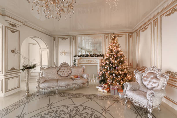 istock Christmas morning. classic luxurious apartments with a white fireplace, decorated christmas tree, sofa, large windows and chandelier. 1076190846
