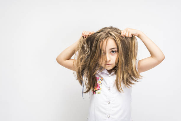 istock Funny angry little girl 1076192290