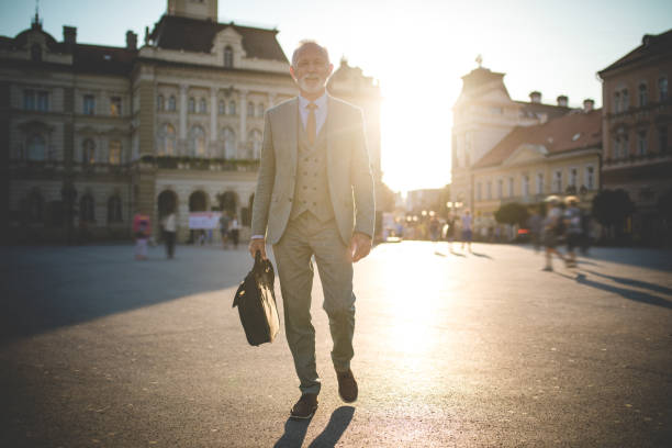 istock Confident senior businessman walking to the office 1076195062