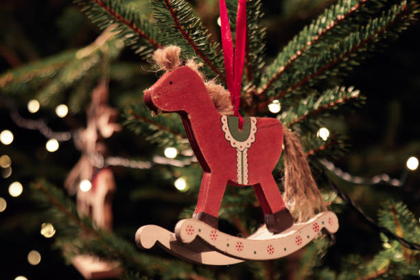 Christmas tree decorated with wooden rocking horse ornament