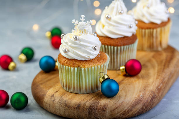 istock Cupcakes with vanilla cream and snowflakes. 1076200892