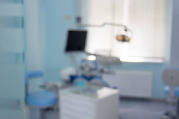 istock Dentist office. Dental treatment unit and equipment with blur background. 1076201524