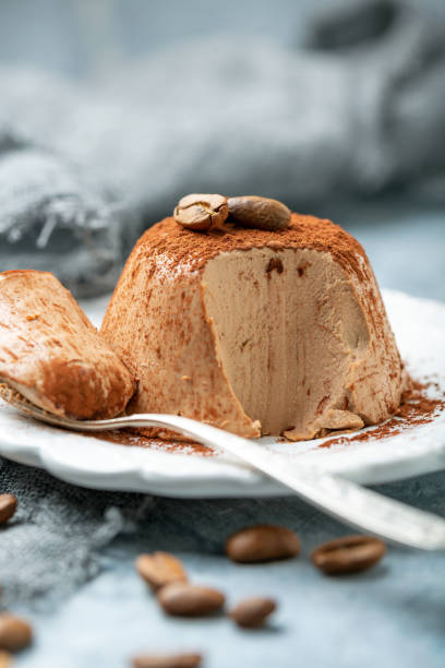 istock Coffee Panna cotta sprinkled with cocoa powder. 1076201820