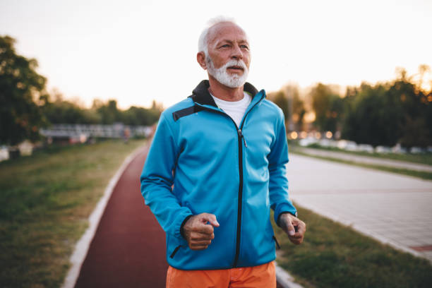 istock Tired senior man running on a track 1076203754