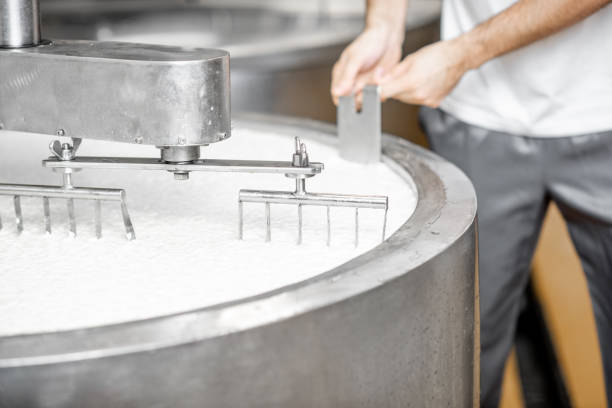 istock Milk mixing at the cheese manufacturing 1076205240
